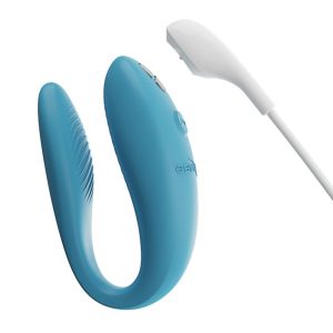 We-Vibe Sync GO Hands-Free Vibrations product image We-Vibe Sync Go in Turquoise shown with its magnetic USB charging cable extended.