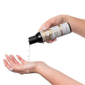 Orgy Human Lube Ultra Slick Ultimate Gel product image Lifestyle action shot showing clear Orgy Human Lube being poured onto hands to demonstrate its ultra-slick, natural fluid-like texture.