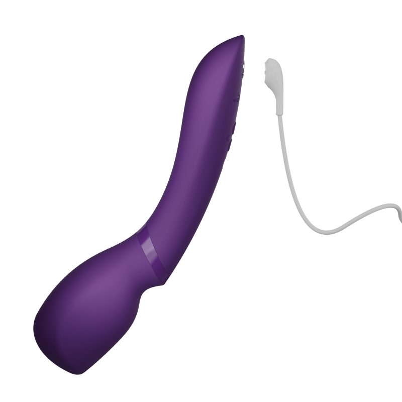 We Vibe Wand 2 Cordless Vibrating Massager connected to USB charging cable showing wireless and rechargeable functionality.
