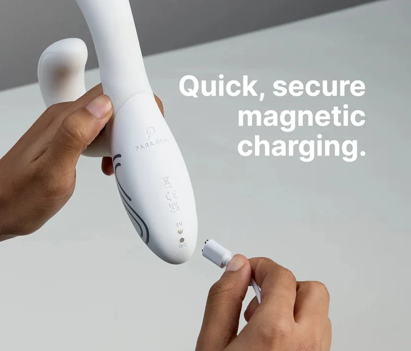 Illumination THE Rabbit App Controlled LED Vibrator product image Magnetic USB charging cable snapping securely onto the base of the white silicone rabbit vibe